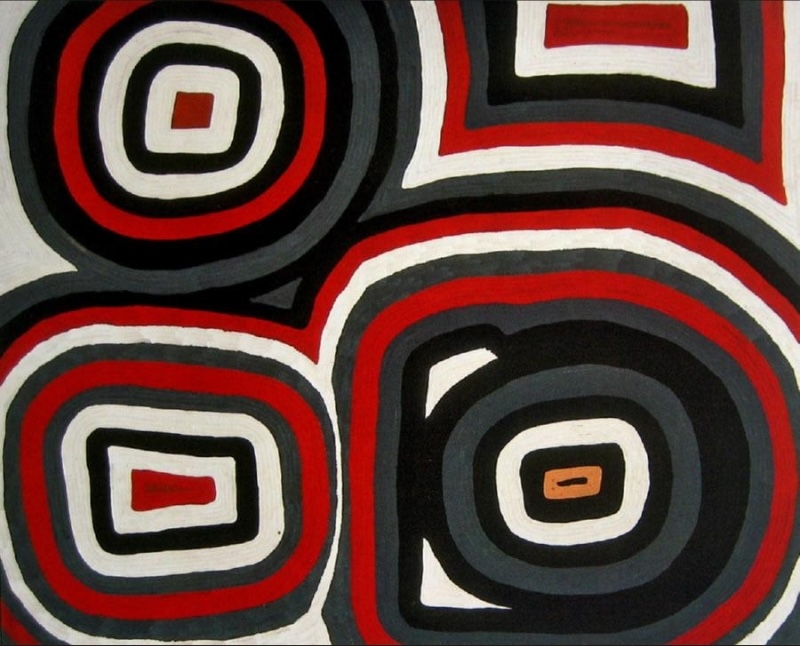 Ronnie Tjampitjinpa’s Two Boys at Wilkinkarra (Lake Mackay) (1992), featuring four large rounded geometric forms built from concentric bands of red, black, white and grey.