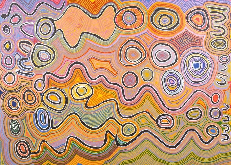 Judy Watson Napangardi painting Mina Mina, 2003, with numerous concentric circular forms and broad undulating bands surrounded by dense flowing lines in pink, orange, yellow, purple, green and white.