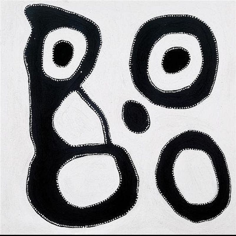 Abstract Aboriginal painting on a pale cream background. A large black interconnected shape occupies the left side, enclosing three white oval spaces and a small solid black oval near the top. Three separate black oval forms of different sizes are arranged on the right side, each surrounding a white centre. Every black shape is outlined with fine white dots, creating strong contrast against the light background.