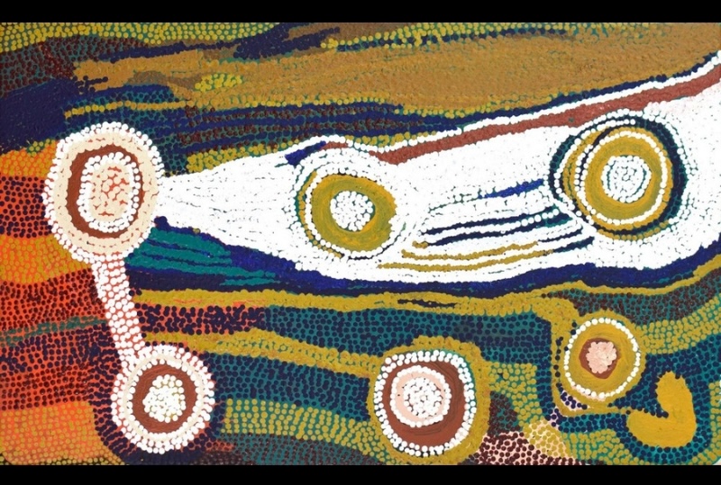 Maggie Watson Napangardi painting with concentric circular motifs linked by white and ochre linear forms across dense fields of green, yellow, orange, blue and red dots.