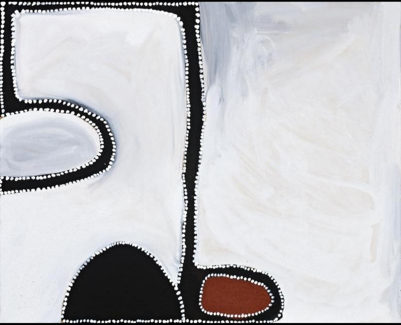 Minimalist Aboriginal painting on a pale cream background with bold black abstract forms framing the composition. A narrow black vertical band divides the painting slightly off centre, while a rounded black shape rises from the lower edge. A small reddish-brown oval outlined in black sits near the lower right corner, and a curved black form encloses a pale oval in the upper left. Fine white dots outline every shape and the outer border, creating a balanced composition with expansive negative space.