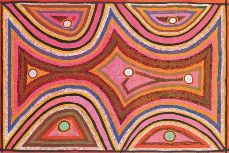 Boxer Milner’s Rainbow Serpent at Sturt Creek (1999), with layered curving bands of pink, red, orange, blue, green, black and white surrounding circular waterhole-like forms.