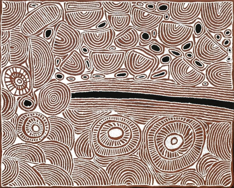 Ochre, black and white Aboriginal painting by Ningura Napurrula densely filled with fine parallel lines forming rounded and semicircular shapes. A long black horizontal band crosses the centre, with several large concentric circular forms below it and clusters of smaller black ovals among curved patterns above.