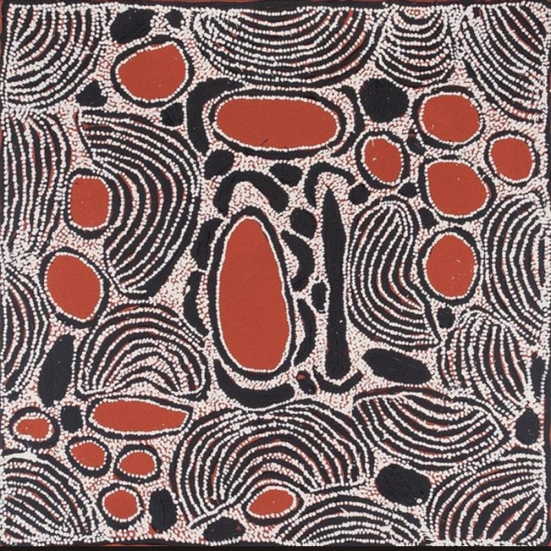 Square black, white and reddish-brown Aboriginal painting by Ningura Napurrula densely filled with large red oval forms, irregular black shapes and sweeping curved bands of white dots. A prominent elongated red form stands near the centre, bordered by black and white, while striped semicircular and rounded patterns overlap across the surrounding field.