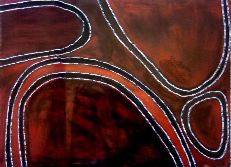 Rover Thomas Yillimbiddi Country painting with sweeping red, black and brown ochre forms outlined by white dots