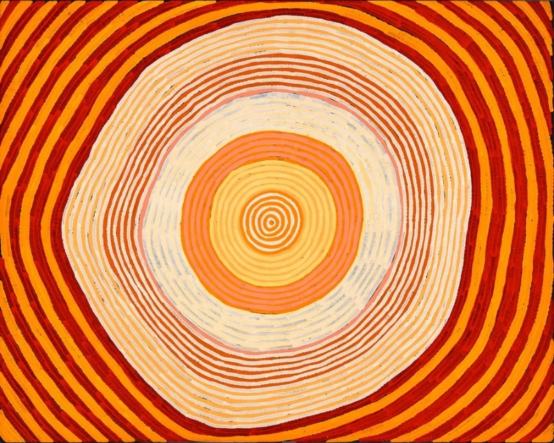Ronnie Tjampitjinpa Palkarulkulnga 2002 painting, featuring a monumental concentric oval of radiating orange, red, yellow, cream and white bands.