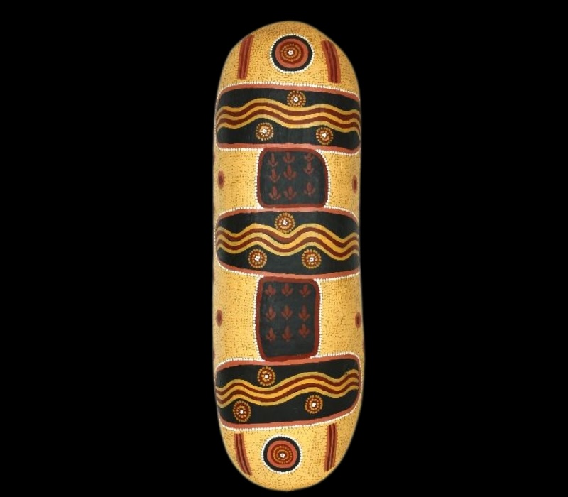 Turkey Tolson Tjupurrula Decorated Coolamon, c.1983. Wooden coolamon painted with black panels, wavy ochre bands, concentric circles and fine dotting on a pale ochre background.