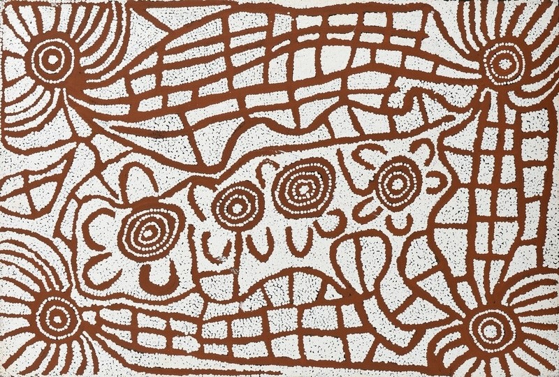 Brown and white Aboriginal painting by Ningura Napurrula with concentric circles, U-shaped motifs and dense dotted areas arranged among large grid-like and radiating linear forms. Four circular motifs surrounded by curved shapes run prominently across the centre of the composition.
