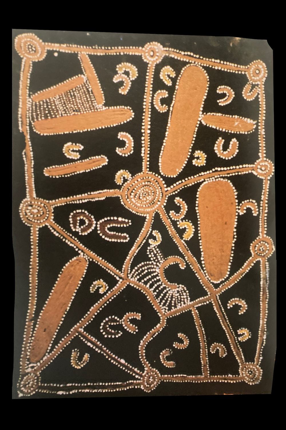 Early Papunya painting by Tjumbalulu Tjungurrayi showing ceremonial designs with concentric circles, pathways and traditional Western Desert symbols.