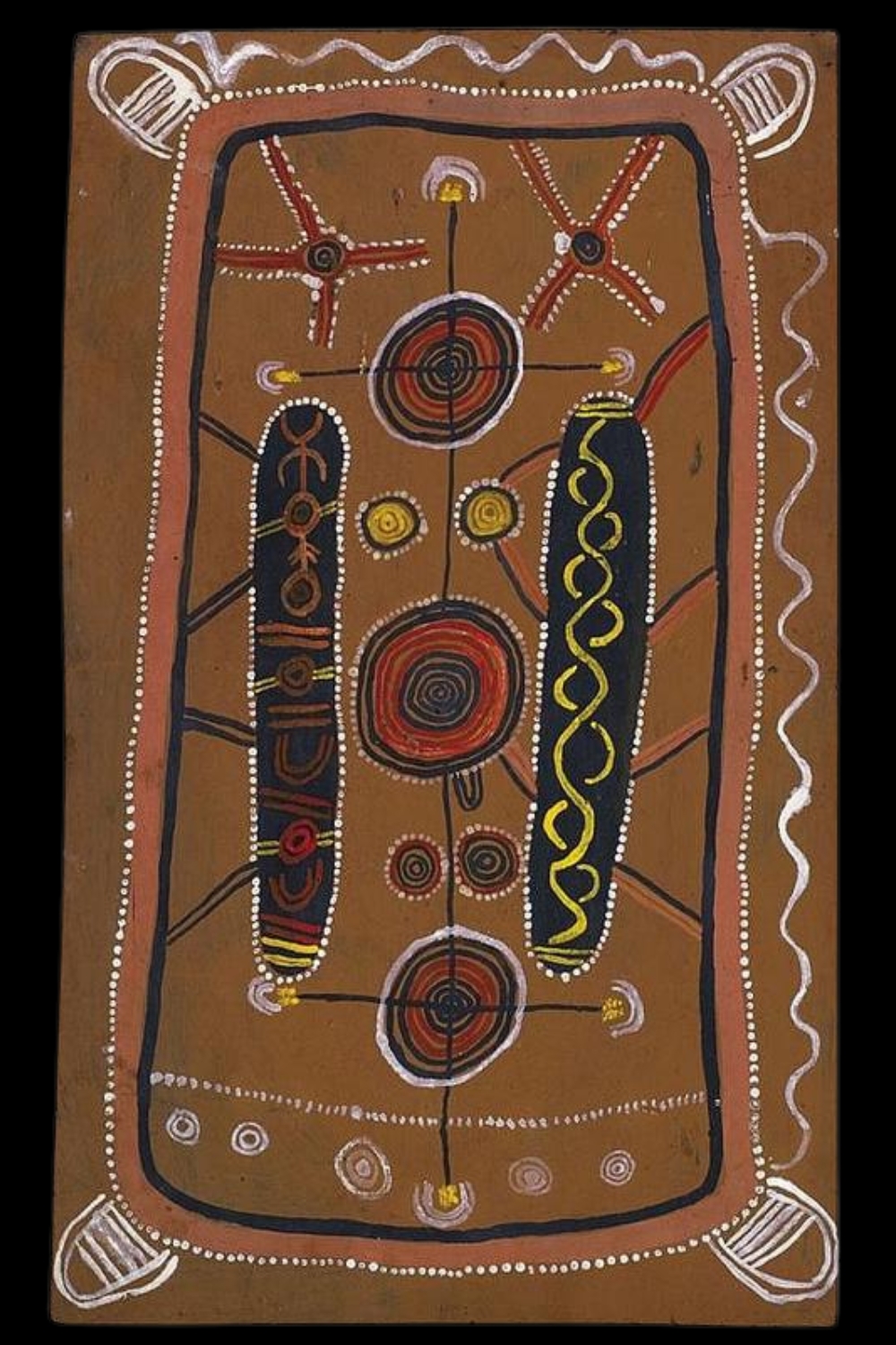 Early painting by Ronnie Tjampitjinpa with concentric circles, travelling lines, dotted borders and ceremonial motifs.