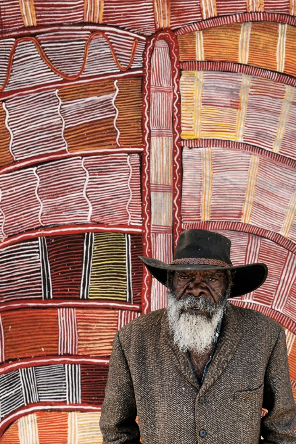 Pintupi artist Mick Namarari Tjapaltjarri with one of his distinctive linear Western Desert paintings.
