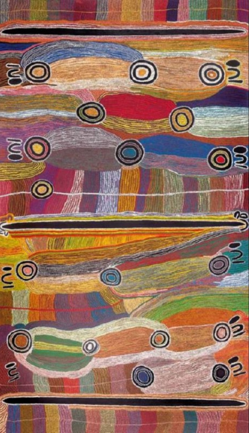 Maggie Watson Napangardi painting with concentric circles, elongated forms and dense parallel lines arranged across fields of red, orange, green, blue, pink and ochre.