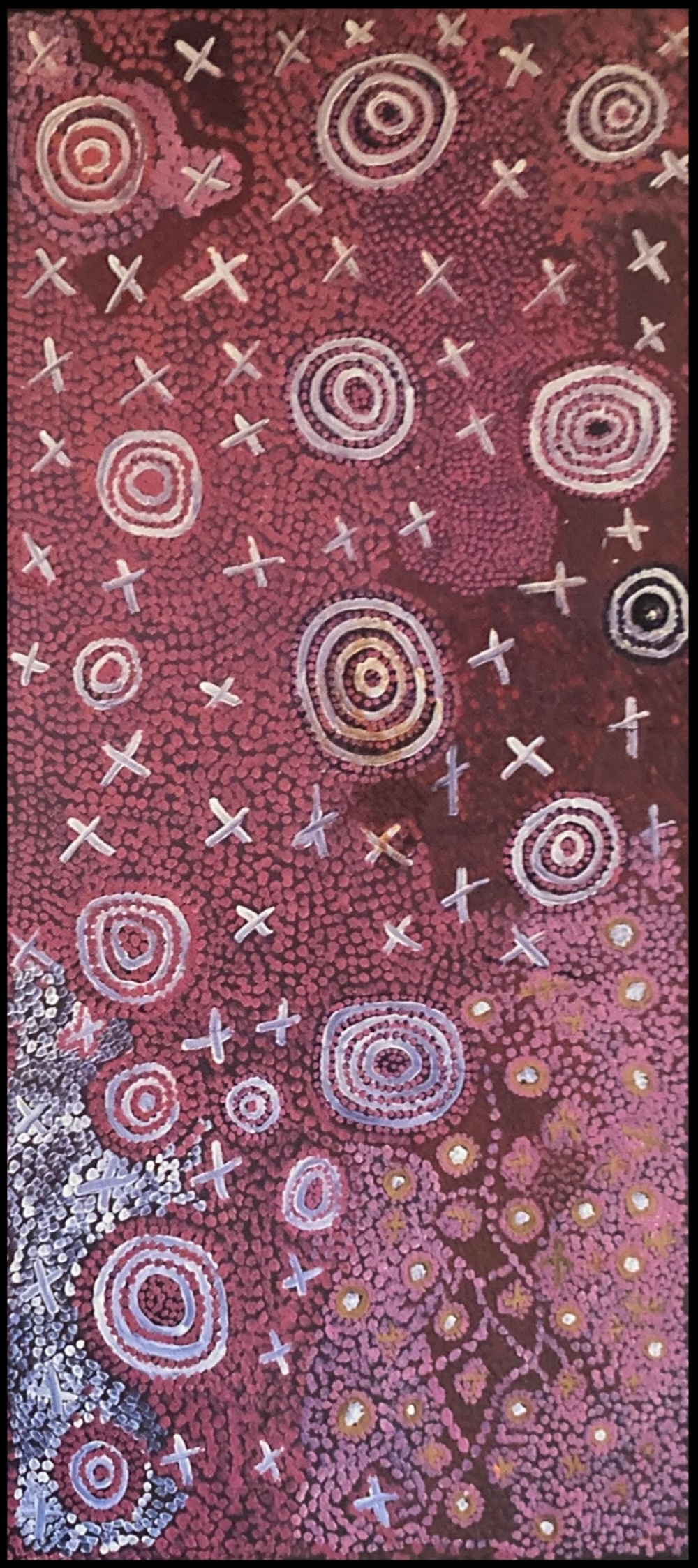 Paddy Japaljarri Stewart painting dominated by red and pink dotting, with numerous concentric circles and repeated white cross-like motifs arranged across the composition.