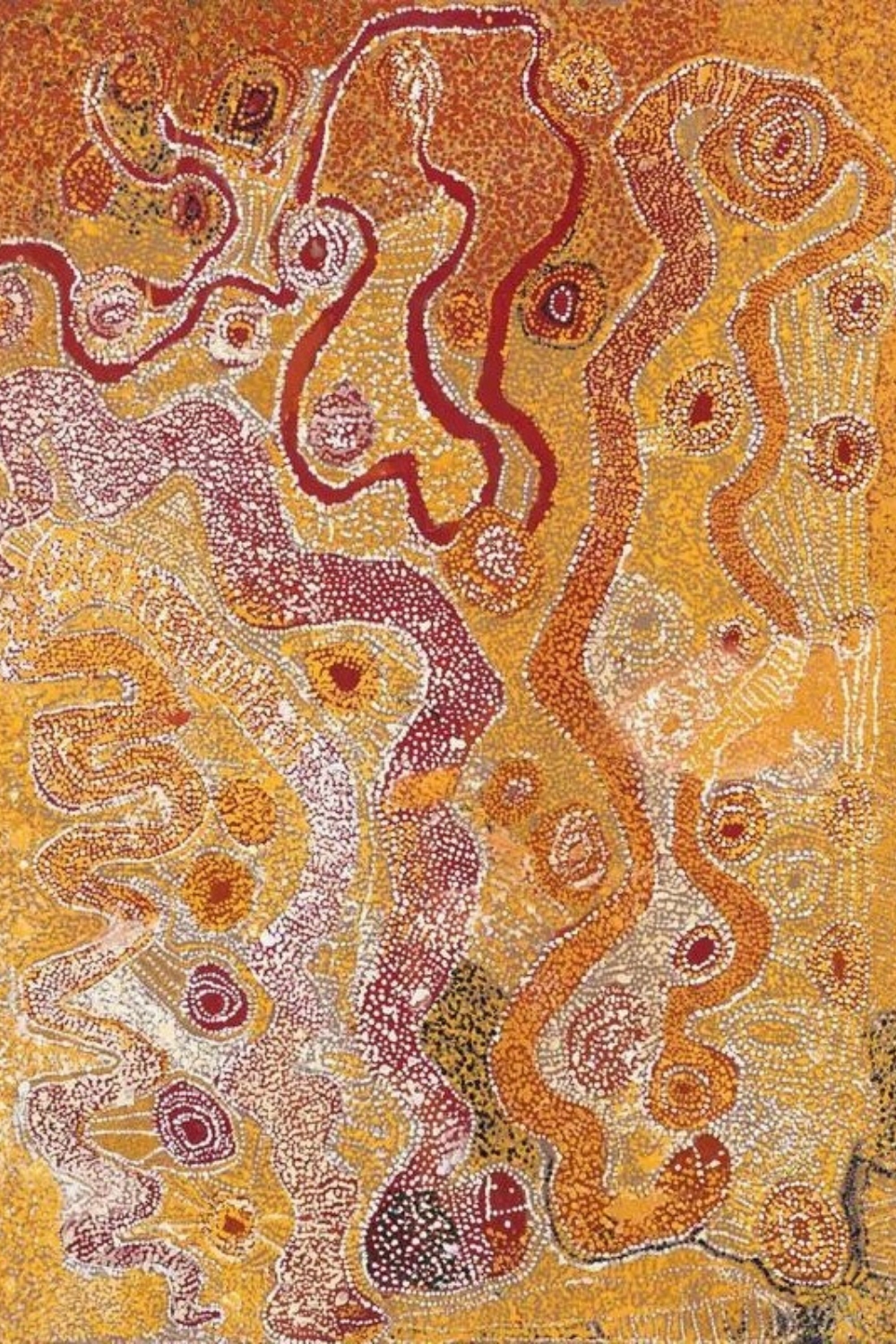 Wimmitji Tjapangarti painting with densely dotted fields, winding pathways, concentric forms and waterhole-like motifs in red, yellow, white and ochre.