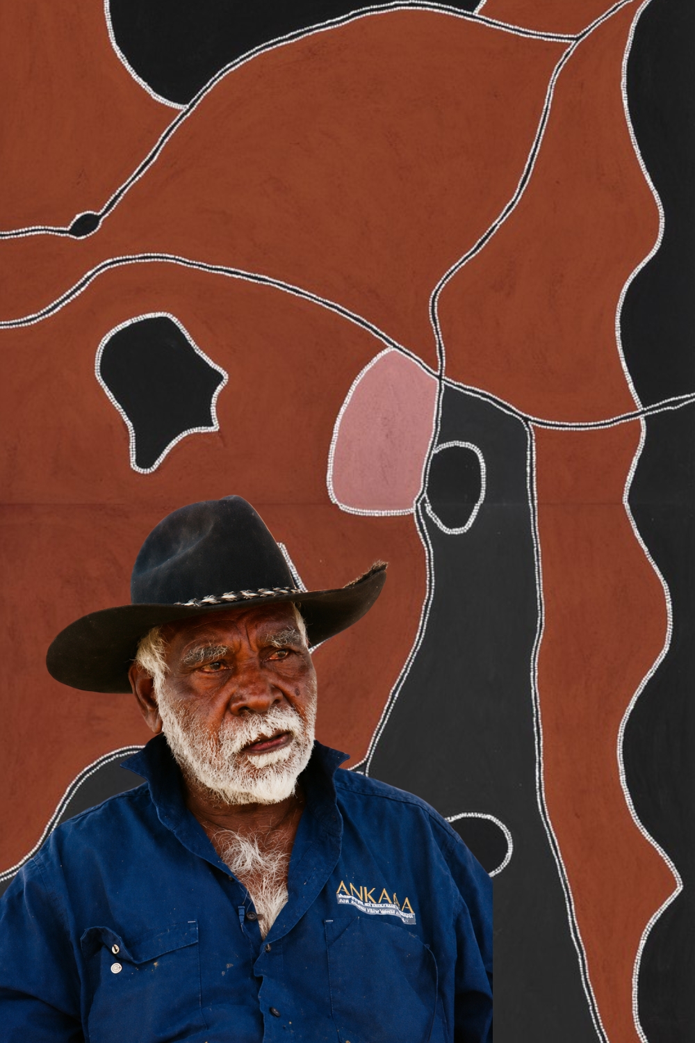 Freddie Timms with an East Kimberley ochre painting