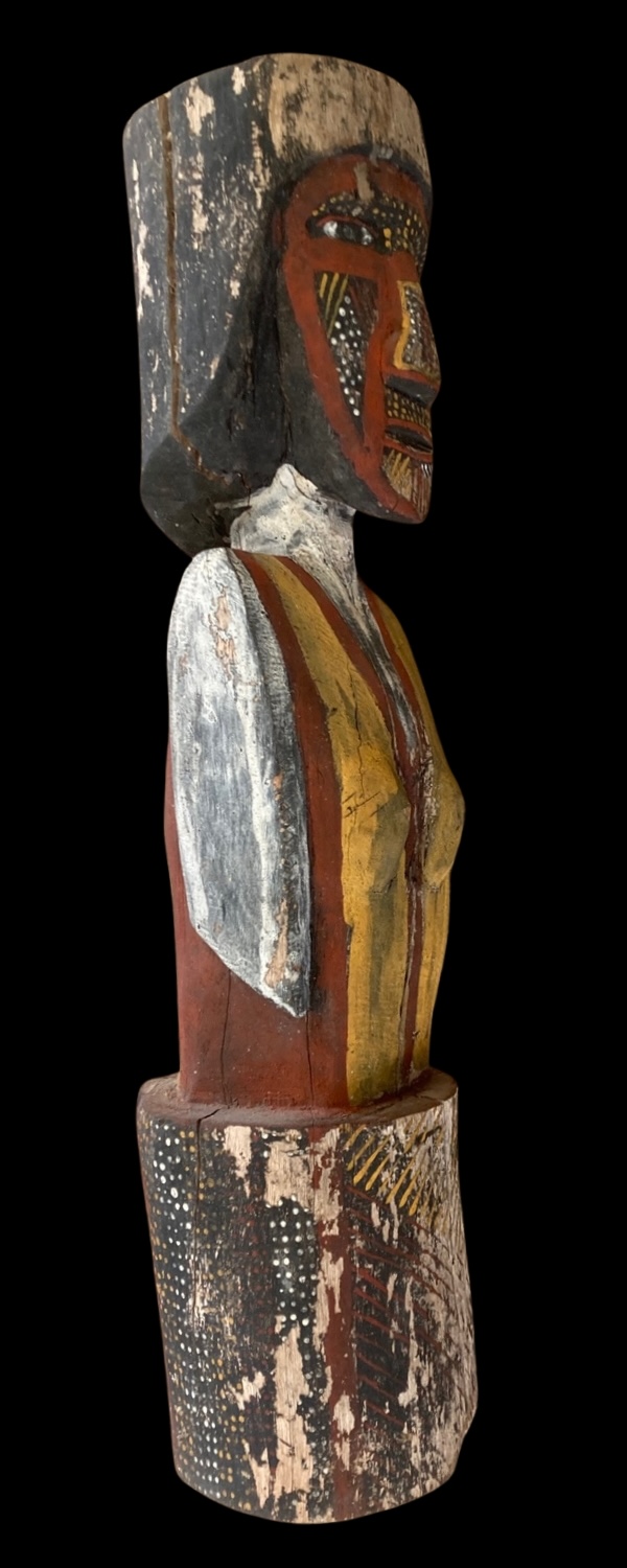 Side view of Mick Aruni Illortamini Bima carved and painted Tiwi sculpture from Paru, Melville Island