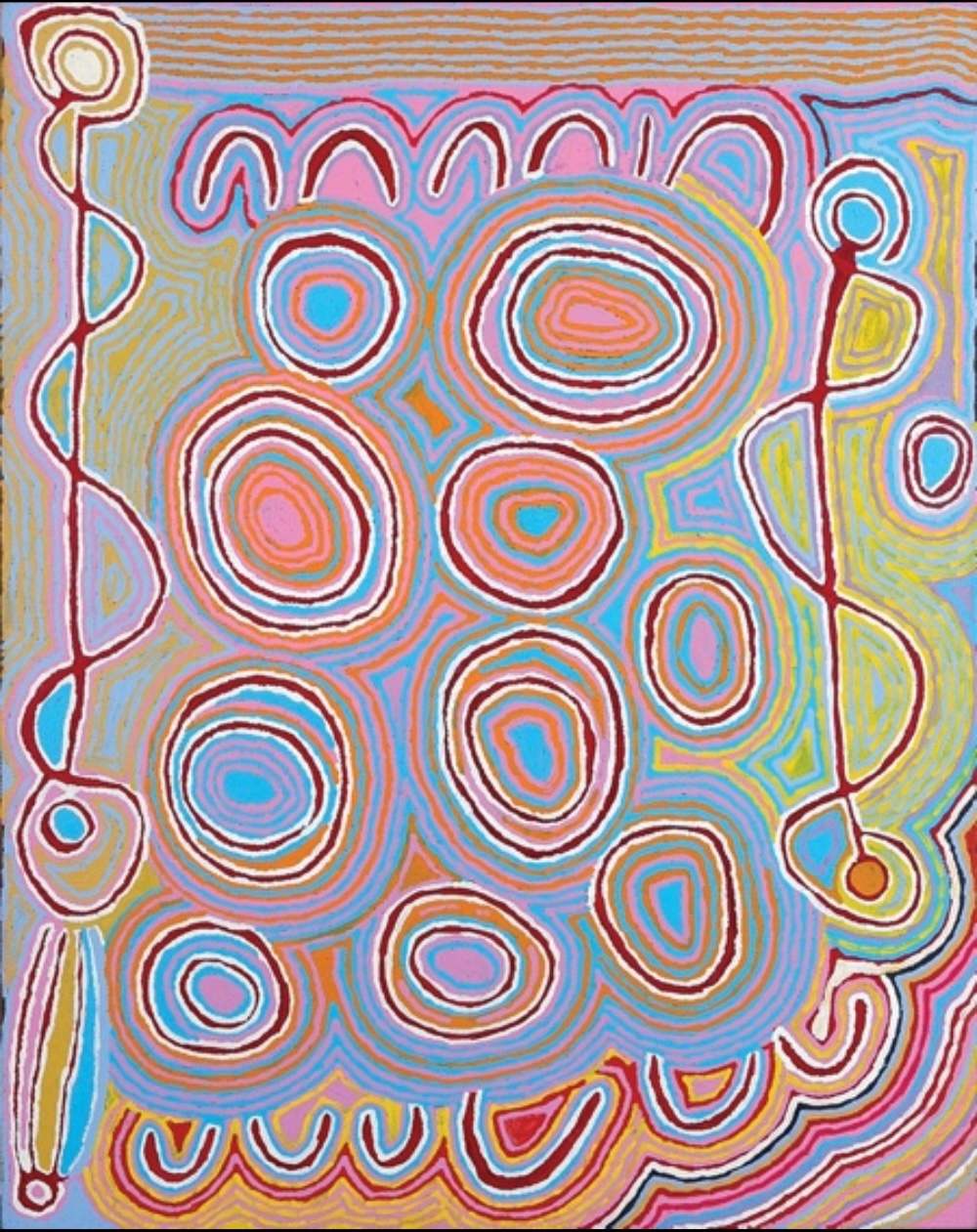 Colourful Judy Watson Napangardi painting with large concentric oval forms surrounded by flowing lines in pink, blue, orange, yellow, red and white.