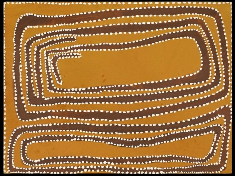 Rover Thomas painting on a golden yellow ochre ground, filled with two large elongated oval forms. Each is built from multiple irregular dark brown bands outlined by rows of white dots. The larger upper form curls inward at the left, while a smaller narrow form stretches across the bottom.
