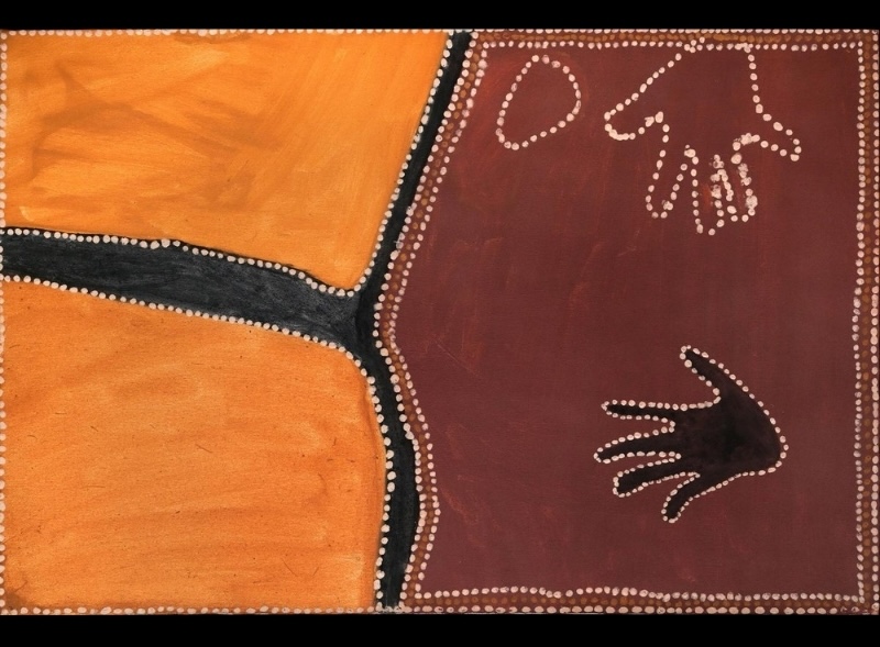 Rover Thomas painting divided between bright orange and dark red-brown fields by a broad black track that enters from the left and forks near the centre. Two hand-like shapes outlined with pale dots appear on the red-brown ground at right, together with a small dotted oval. White and brown dots trace the boundaries and edges of the painting.