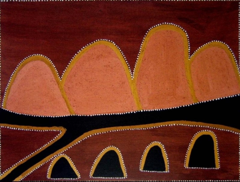 Rover Thomas painting of rounded hills in pink, orange, yellow, red-brown and black ochres. Four large pink-orange hills rise across the upper half against a dark red-brown ground. A broad black river or creek runs horizontally through the centre, while four smaller black hill shapes appear along the bottom. Fine rows of white dots outline the hills, waterways and edges of the painting.