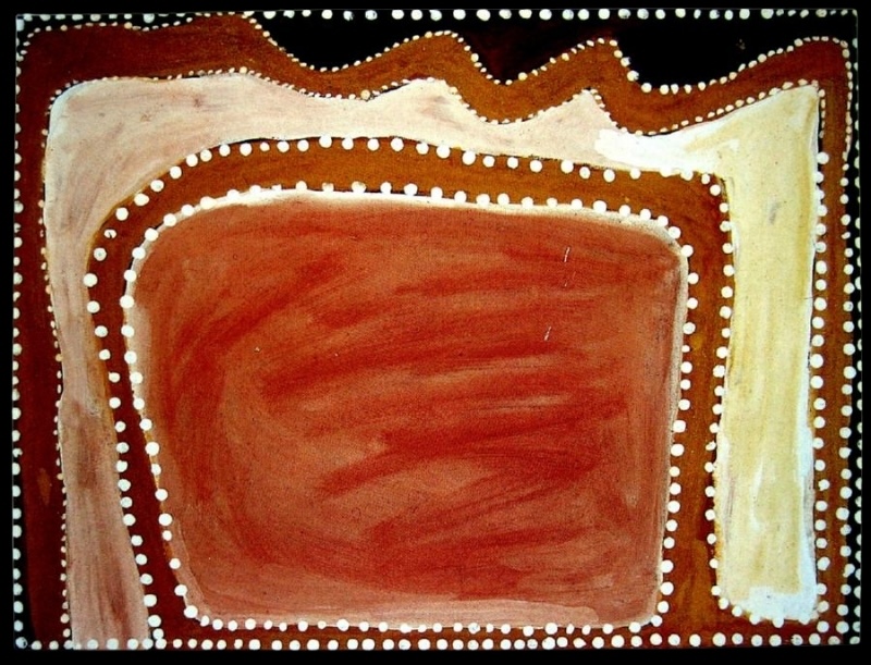 Rover Thomas painting with a large rounded red and orange ochre rectangle filling the centre. The central form is surrounded by a reddish-brown band and rows of large white dots, with broad cream and pale yellow areas along the left, top and right edges. A jagged dark red and brown band runs across the top against a black border.