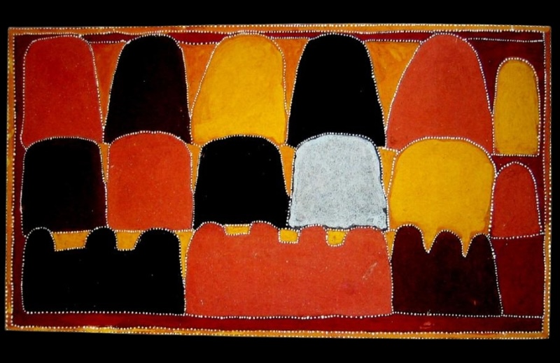 Queenie McKenzie ochre landscape with rows of rounded hills in red, yellow, black and grey, all finely outlined with white dots.