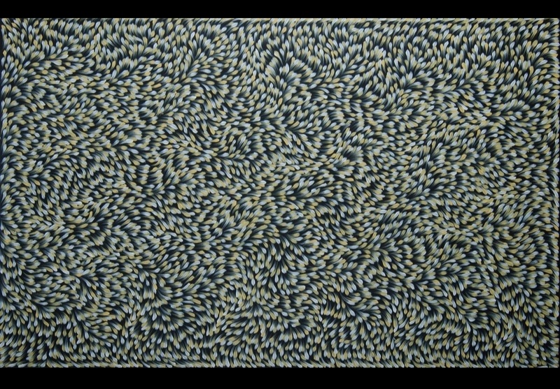 Gloria Petyarre painting of thousands of pale blue, cream and white leaf-shaped brushstrokes swirling across a dark ground.