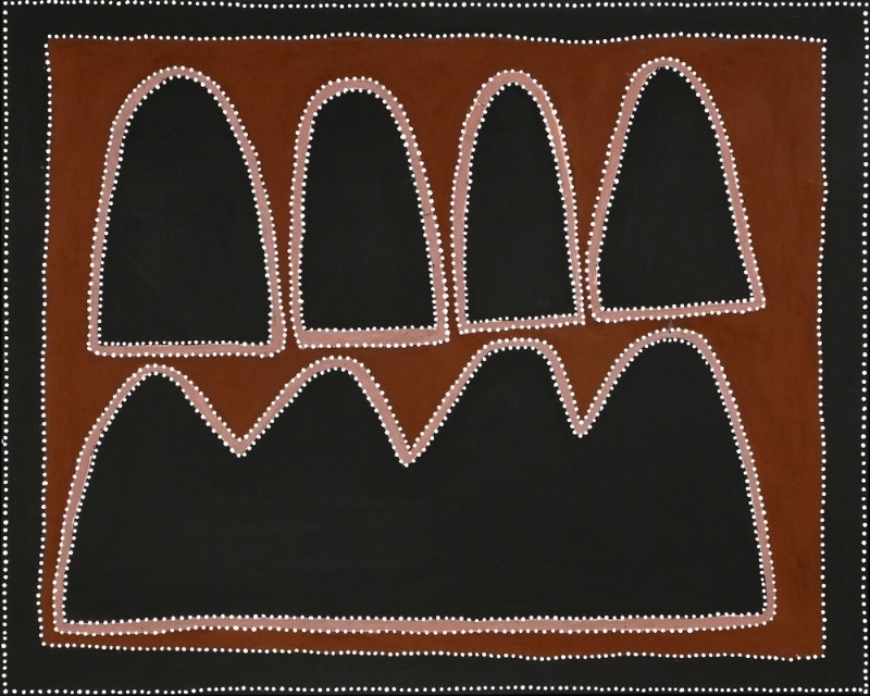 Queenie McKenzie ochre landscape with four tall black hills above a broad four-peaked black range, outlined in pink and white dots on brown.