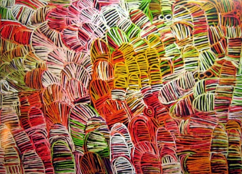 Large Minnie Pwerle painting densely filled with overlapping striped forms in red, pink, green, yellow, orange, white and black, with small circular motifs among the patterns.