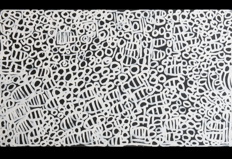 Minnie Pwerle painting densely filled with white rings, loops and rounded striped shapes extending across a dark grey-black background.