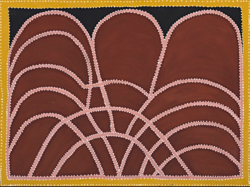 Ochre painting with overlapping arched red-brown hills on a black ground, crossed by sweeping curved bands outlined with rows of white dots and enclosed by a yellow dotted border.