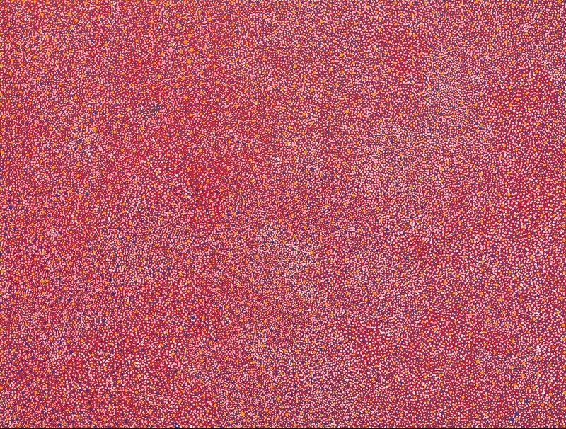Aharlper Country painting by Angelina Pwerle, densely covered with thousands of tiny pink, white, yellow and orange dots across a vivid red ground.