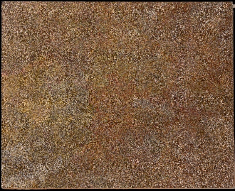 Kathleen Petyarre’s Untitled, 1995, densely covered with minute ochre, yellow, white and reddish dots forming softly shifting fields.