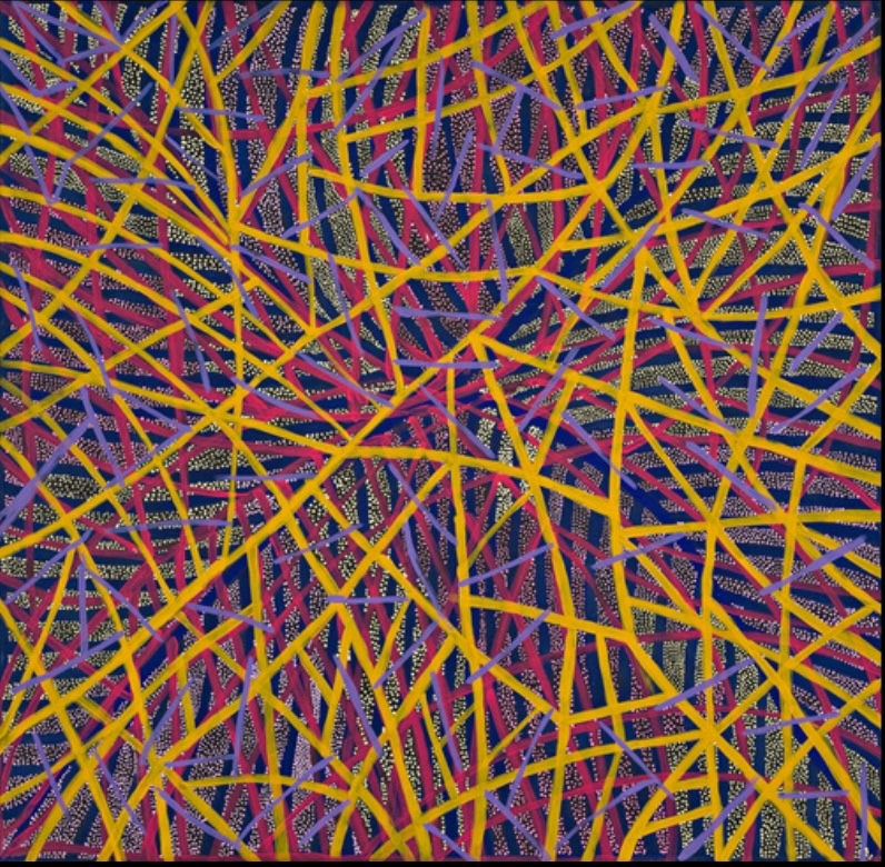 Painting by Gloria Petyarre with a dense network of intersecting yellow, red and purple lines over patterned fields of fine yellow and white dots on a dark ground.