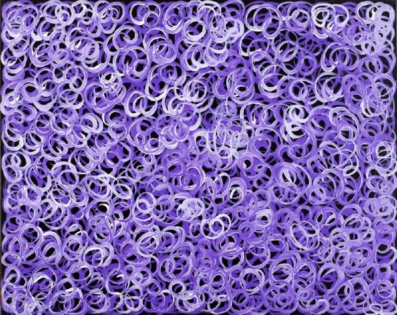 Gloria Petyarre painting of densely overlapping violet, lavender and white looping brushstrokes against a dark ground.