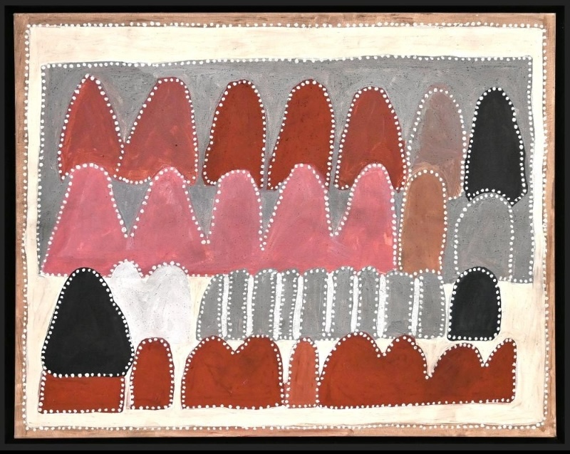 Queenie McKenzie ochre landscape with densely layered red, pink, grey, white and black limestone hills outlined by rows of white dots.