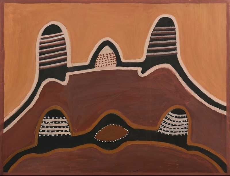 Hector Jandany Aboriginal ochre painting showing layered red-brown hills with five rounded black peaks patterned with horizontal bands and dots, surrounding a central oval form.