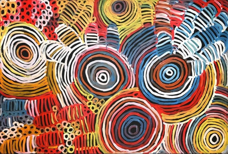 Minnie Pwerle Awelye Atnwengerrp painting with large concentric circles, striped body-paint forms and Bush Melon imagery in vivid colours.
