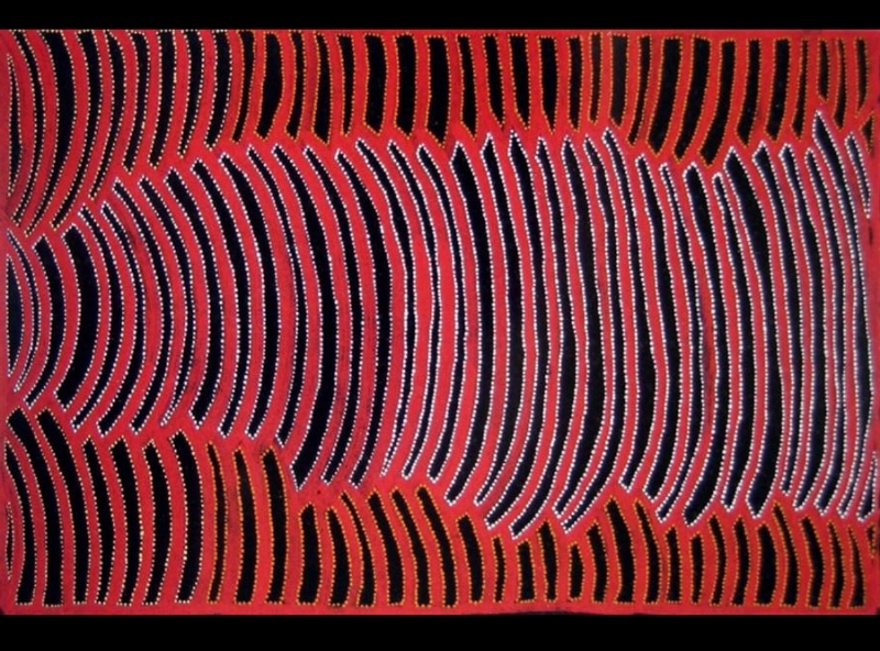 Painting by Gloria Petyarre with large interlocking red curved forms filled with black and edged by fine rows of white dots.