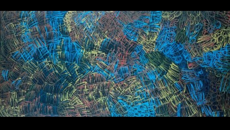 Large Minnie Pwerle painting filled with dense overlapping blue, green, yellow and muted red linear forms, creating an intricate field of curved and cross-hatched marks on a dark ground.