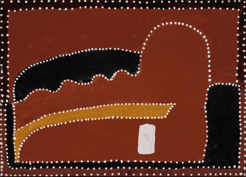 Queenie McKenzie ochre painting of Kelly’s Knob, with a large red hill, black rocky forms and a yellow path outlined in white dots.
