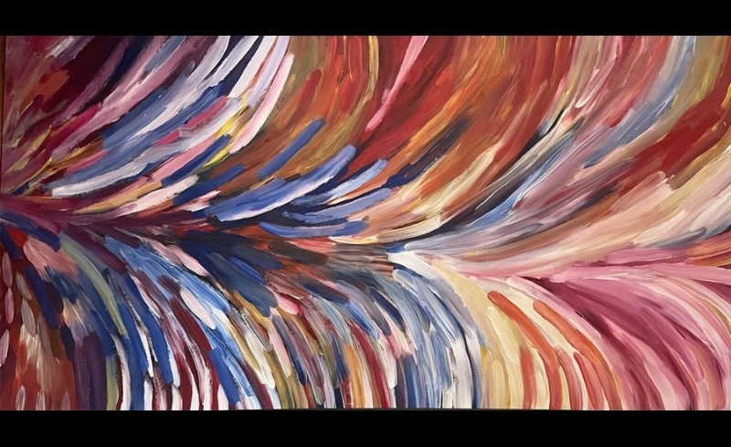 Gloria Petyarre painting of broad multicoloured leaf-like brushstrokes sweeping across the canvas in large flowing bands.