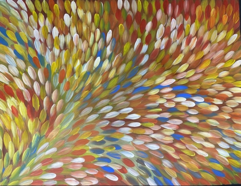 Gloria Petyarre painting of multicoloured bush medicine leaves flowing in broad sweeping currents across the canvas.