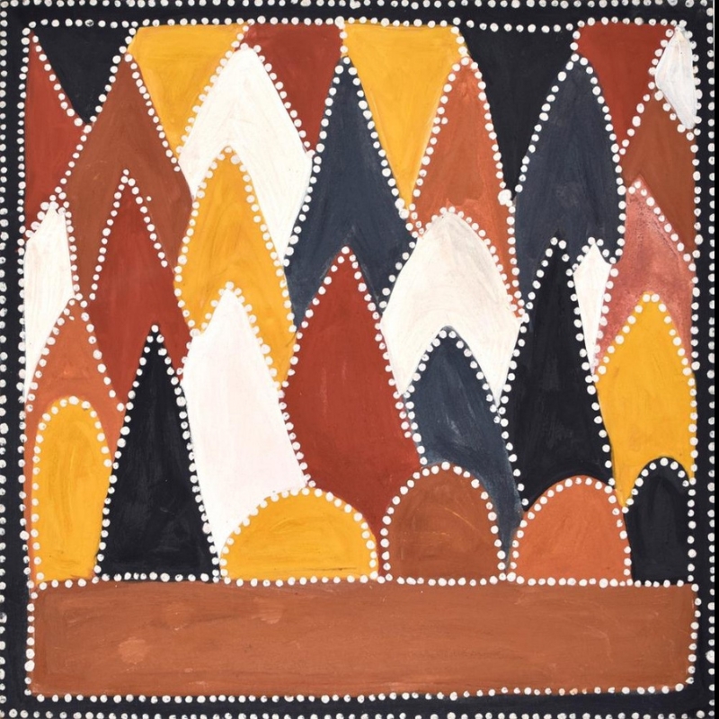 Queenie McKenzie ochre landscape filled with overlapping rocky hills in red, yellow, white and black, each outlined with white dots.