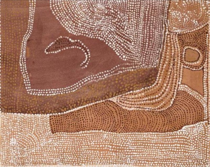 Rover Thomas painting of Canning Stock Route Country in brown, tan and cream ochres. Dense fields of white, brown and yellow dots form curving bands across the canvas, surrounding a large open reddish-brown area at upper left. A small curved dotted shape lies within this open field, while layered bands sweep down the right side and across the bottom.