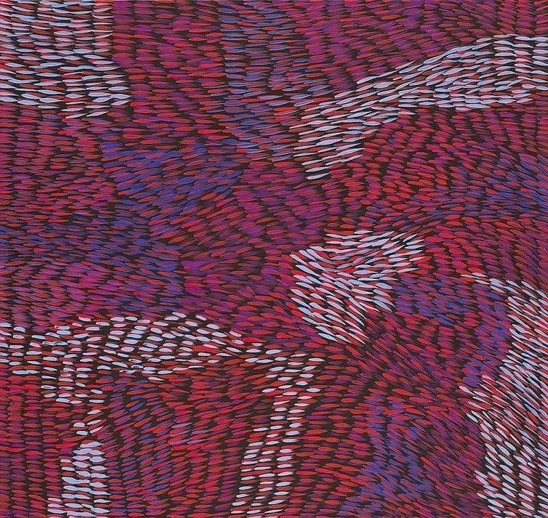 Painting by Gloria Petyarre filled with thousands of short red, purple, pink and pale blue brush marks flowing in curved, overlapping bands across a dark ground.