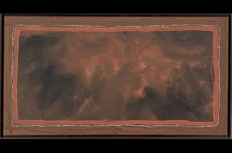 Rover Thomas Canning Stock Route 1995, a large dark ochre landscape with a broad atmospheric central field enclosed by fine dotted borders.