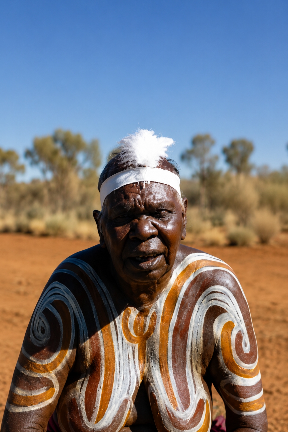Aboriginal woman wearing ochre body designs for women's ceremony