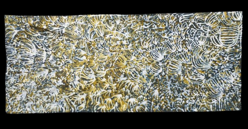 Emily Kame Kngwarreye Awelye, c.1987, cotton batik with dense white, ochre and dark wax-resist lines, dots and looping organic forms.