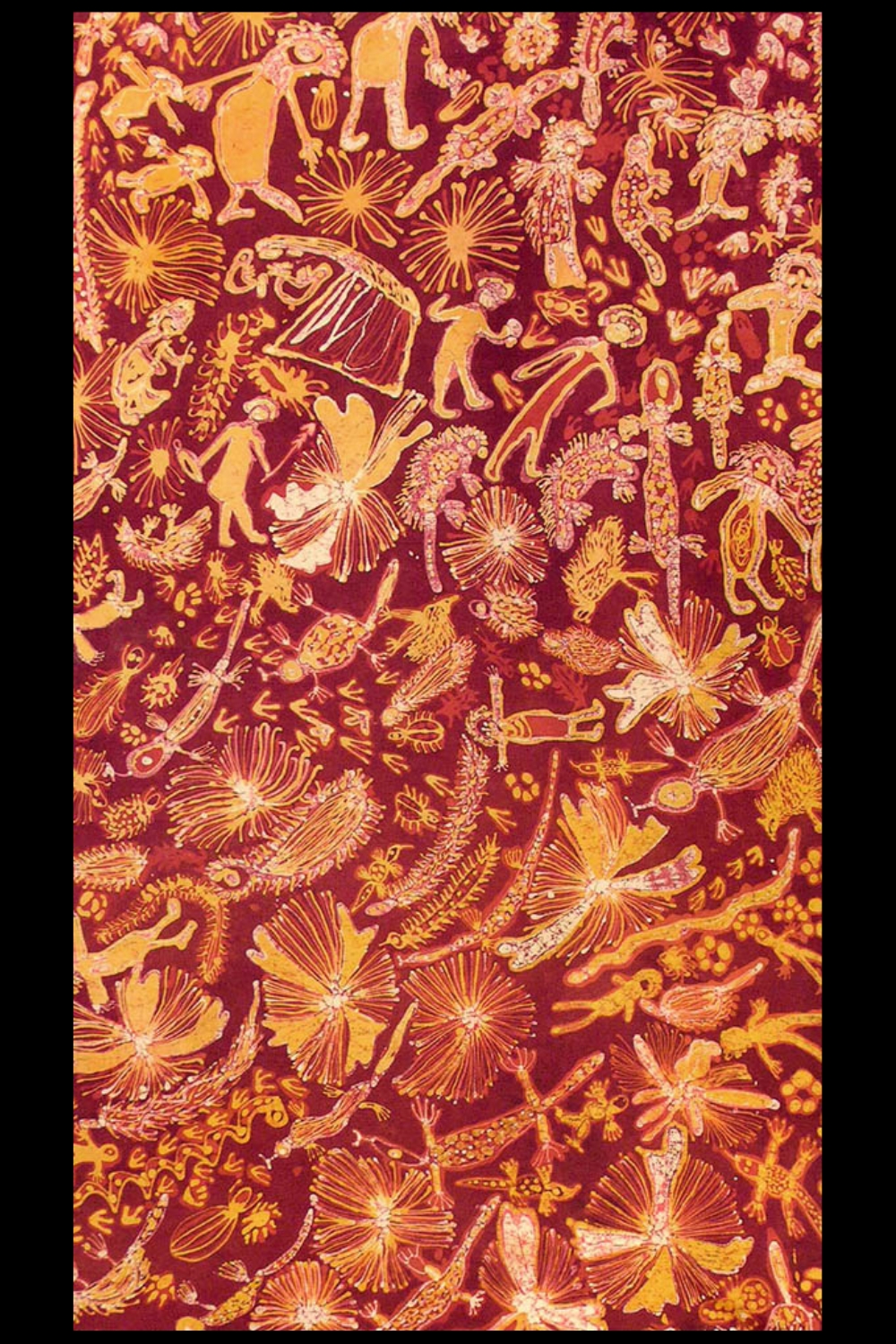 Batik on fabric with figures, animals and plants in yellow and ochre against a deep red ground.